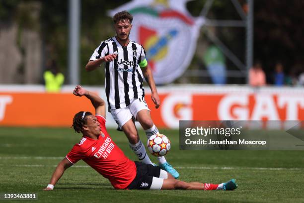 Diego Moreira of SL Benfica challenges Andrea Bonetti of Juventus during the UEFA Youth League 2021/22 Semi-final between Juventus and SL Benfica at...