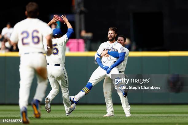 Jesse Winker of the Seattle Mariners celebrates his RBI single to score Adam Frazier to beat the Kansas City Royals 5-4 during the twelfth inning at...