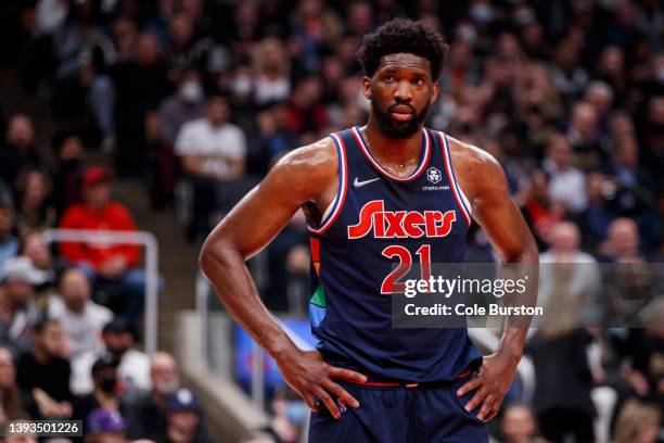 Joel Embiid of the Philadelphia 76ers looks on in the first half of Game Three of the Eastern Conference First Round against the Toronto Raptors at...