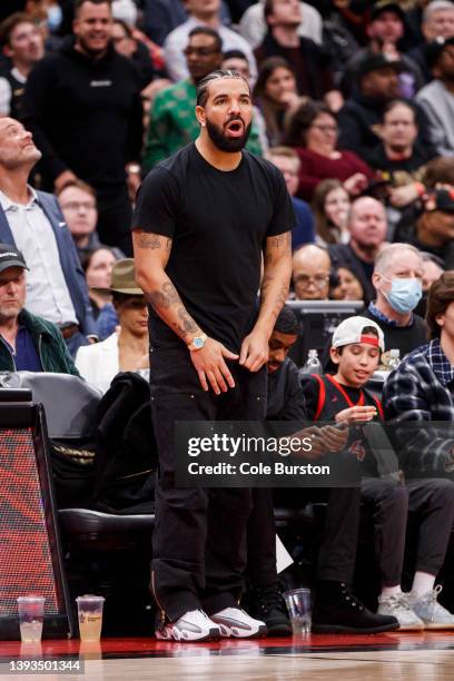 Rapper Drake watches Game Three of the Eastern Conference First Round between the Toronto Raptors and the Philadelphia 76ers at Scotiabank Arena on...