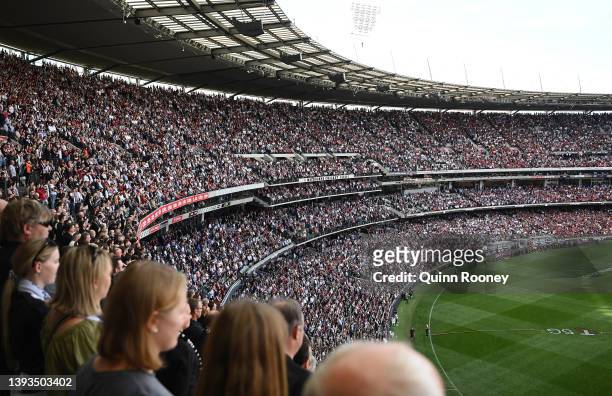 The crowd stands for a minute silence for Anzac Day during the round six AFL match between the Essendon Bombers and the Collingwood Magpies at...