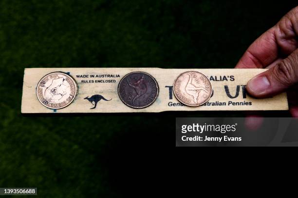 Two-up flat board called a "kip" or a paddle holding pennies is seen at the Woolpack Hotel in Redfern on April 25, 2022 in Sydney, Australia. Anzac...