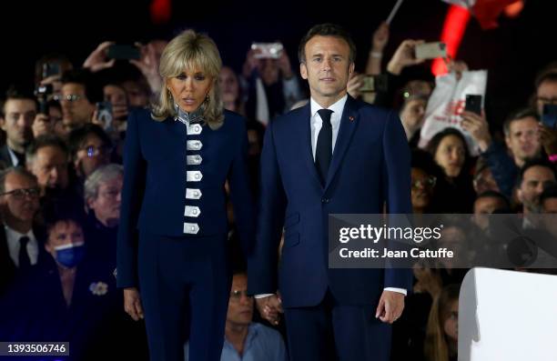 French President Emmanuel Macron celebrates his re-election with his wife Brigitte Macron at the Champ de Mars near the Eiffel Tower on April 24,...