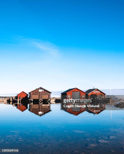beautiful water reflection of boathouses - båthus bildbanksfoton och bilder