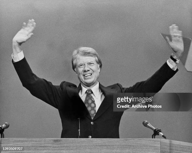 American politician Jimmy Carter smiles and waves to the auditorium at the close of the 1976 Democratic National Convention, where Carter was...
