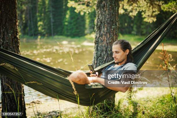 spending nice time in the nature - young men camping stock pictures, royalty-free photos & images
