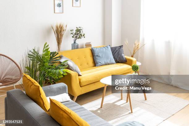 interior of a modern living room in nordic style - yellow room stock pictures, royalty-free photos & images