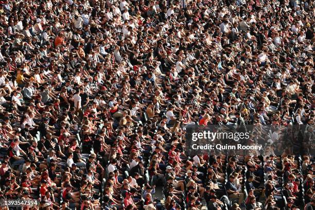 Fans watch on during the round six AFL match between the Essendon Bombers and the Collingwood Magpies at Melbourne Cricket Ground on April 25, 2022...