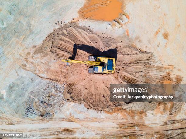 backhoe working on a terrain - mineral stock pictures, royalty-free photos & images