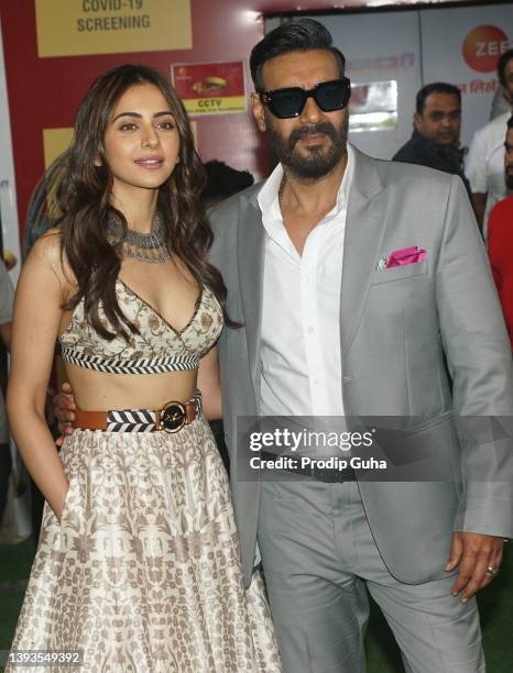 Rakul Preet Singh and Ajay Devgan attend the "Runway 34" film photocall on April 25, 2022 in Mumbai, India.