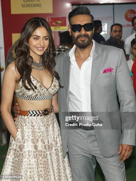 Rakul Preet Singh and Ajay Devgan attend the "Runway 34" film photocall on April 25, 2022 in Mumbai, India.