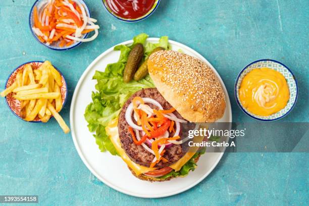 homemade burger with cheese and tomato - burger top view stock pictures, royalty-free photos & images