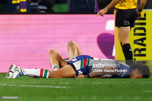 Dallin Watene-Zelezniak of the Warriors lays on the field after a contest during the round seven NRL match between the Melbourne Storm and the New...