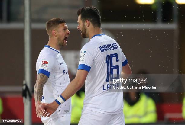 Tobias Kempe and Luca Pfeiffer of SV Darmstadt 98 celebrate after scoring their sides first goal during the Second Bundesliga match between FC St....
