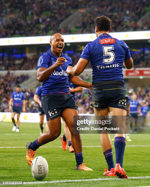 Felise Kaufusi of the Storm congratulates Xavier Coates of the Storm after scoring a try during the round seven NRL match between the Melbourne Storm...