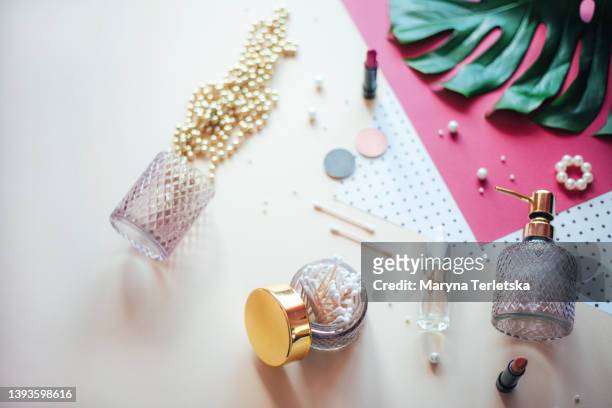 flat lay with beautiful female details and flowers. there is a place for text. - luxury cosmetics stock pictures, royalty-free photos & images
