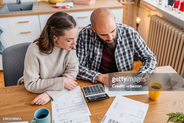 young couple discussing their finances - demonstration against the marriage for all bill stock pictures, royalty-free photos & images