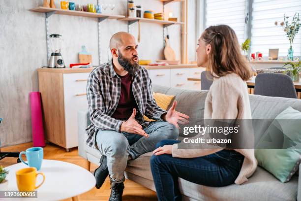 young couple arguing at home - jealous wife stock pictures, royalty-free photos & images