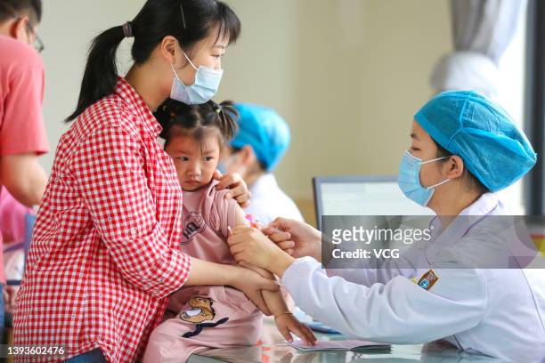 Child is vaccinated at a community health service station on China Prophylactic Vaccination Day on April 25, 2022 in Huzhou, Zhejiang Province of...