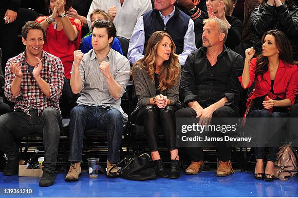 Seth Meyers, guest, Christine Baumgartner, Kevin Costner and Eva Longoria attend the Dallas Mavericks vs New York Knicks game at Madison Square...