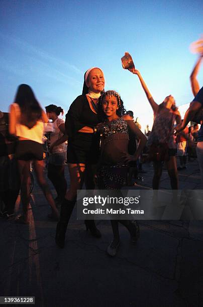 Brazilian revelers pose while celebrating during Carnival on February 18, 2012 in Rio de Janiero, Brazil. Carnival is the grandest holiday in Brazil,...