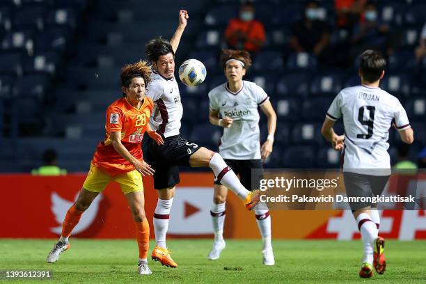 Ryuji Hirota of Chiangrai United competes for a header against Hotaru Yamaguchi of Vissel Kobe during the first half of the AFC Champions League...