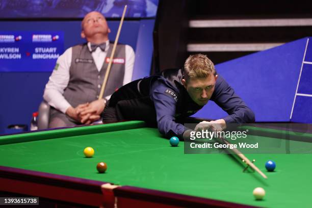 Kyren Wilson of England plays a shot during the Betfred World Snooker Championship Round Two match between Stuart Bingham of England and Kyren Wilson...