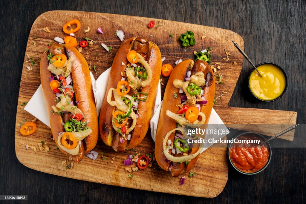Artisan Hot Dogs in Brioche Rolls with pickles, onion and relishes.