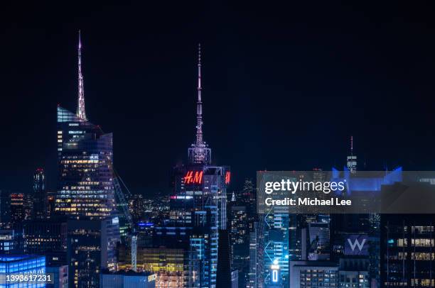 high angle night view of times square in new york - spire stock pictures, royalty-free photos & images