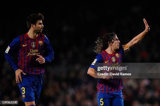Carles Puyol of FC Barcelona and his teammate Gerard Pique looks on during the La Liga match between FC Barcelona and Valencia CF at Camp Nou stadium...