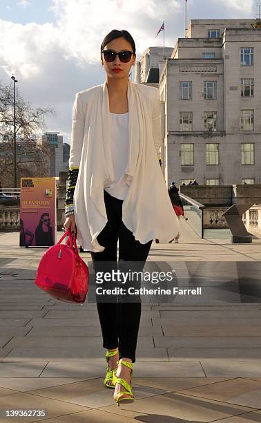 Fashion blogger Cindy Ko wears a Sass & Bide white jacket, black Levi jeans, white American Apparel top, pink Furla bag, Elizabeth James Sunglassses...