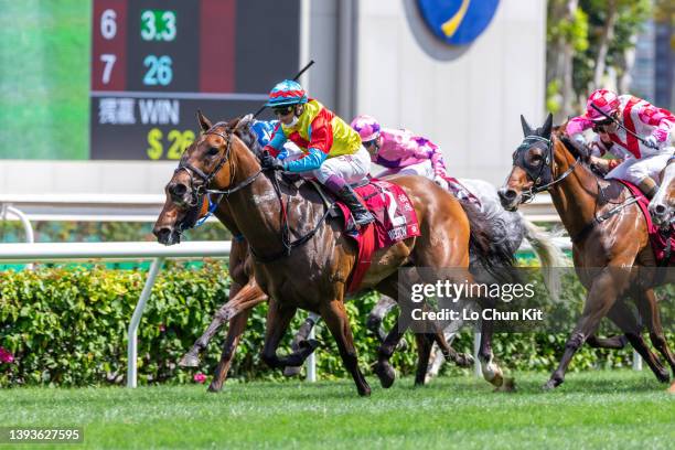 Jockey Alexis Badel riding Wellington wins the Race 6 Chairman's Sprint Prize at Sha Tin Racecourse on April 24, 2022 in Hong Kong.