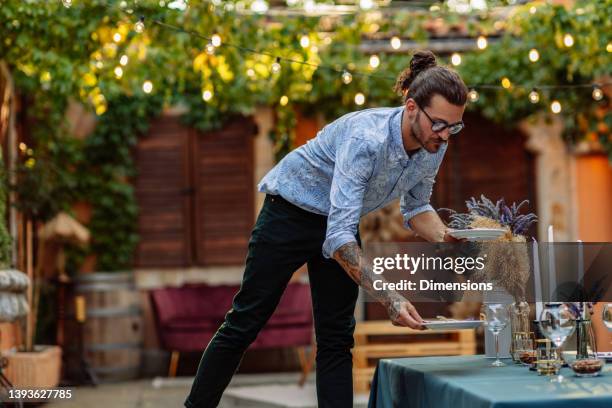 he knows how to arrange table - garden brunch bildbanksfoton och bilder