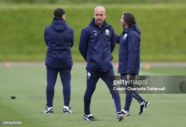 Pep Guardiola, Manager of Manchester City looks on during the Manchester City Training Session at Manchester City Football Academy on April 25, 2022...