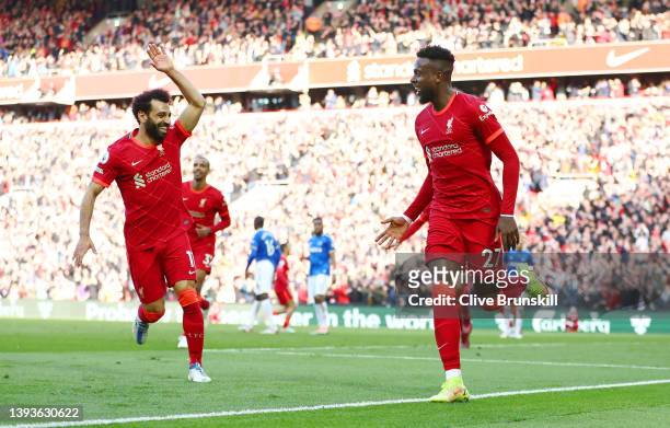 Divock Origi celebrates eith Mohamed Salah of Liverpool after scoring their team's second goal during the Premier League match between Liverpool and...
