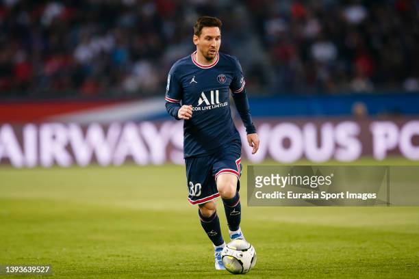 Lionel Messi of Paris Saint Germain runs with the ball during the Ligue 1 Uber Eats match between Paris Saint-Germain and Olympique de Marseille at...