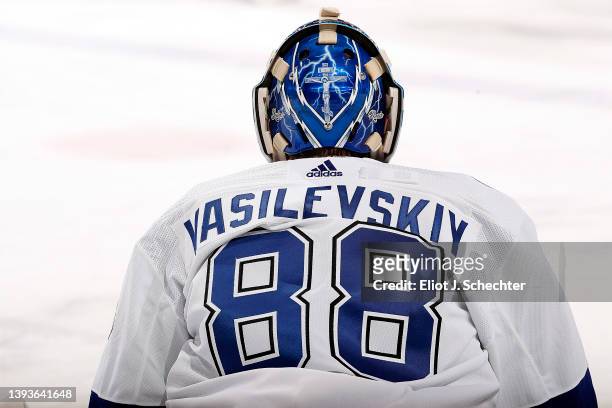 Goaltender Andrei Vasilevskiy of the Tampa Bay Lightning stretches on the ice during warm ups prior to the start of the game against the Florida...