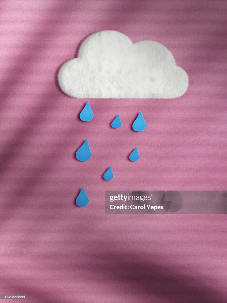 Bad weather papercraft. rain in pink paper background