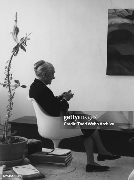 Profile view of American artist Georgia O'Keeffe as she sits in her studio, Abiquiu, New Mexico, 1977.