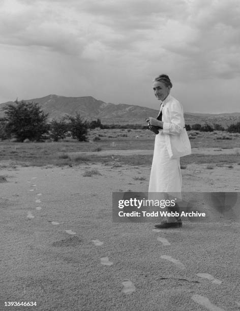 Portrait of American artist Georgia O'Keeffe , a camera in her hands, near Abiquiu, New Mexico, 1959.