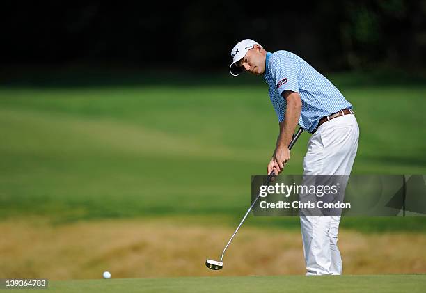 Bill Haas putts from the fringe of the 12th green during the final round of the Northern Trust Open at Riviera Country Club on February 19, 2012 in...