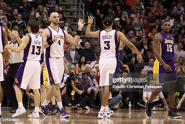 Marcin Gortat of the Phoenix Suns high-fives Jared Dudley after scoring against the Los Angeles Lakers during the NBA game at US Airways Center on...