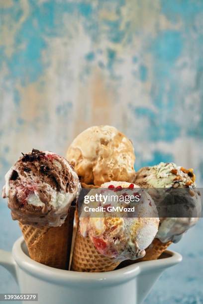 pistachio, chocolate, strawberry and vanilla ice cream in a cone - ice cream cone stockfoto's en -beelden