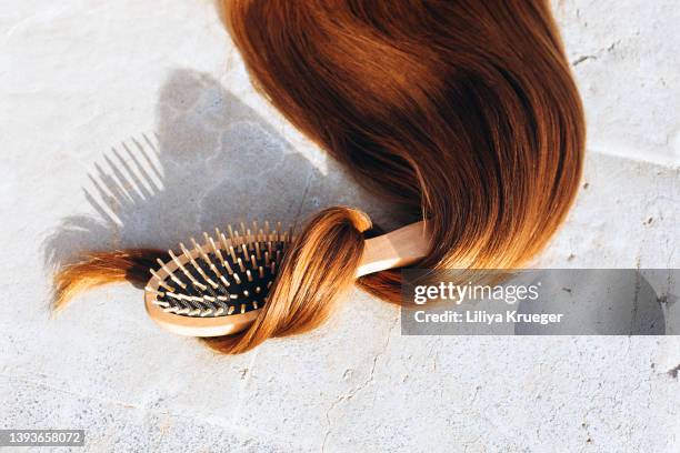 shiny long hair with a comb. - long straight hair stock pictures, royalty-free photos & images