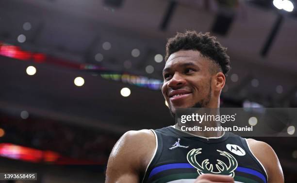 Giannis Antetokounmpo of the Milwaukee Bucks smiles at fans near the end of Game Four of the Eastern Conference First Round Playoffs against the...