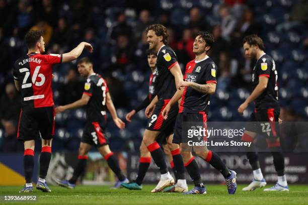 Lewis Travis of Blackburn Rovers celebrates with teammates after scoring their team's fourth goal during the Sky Bet Championship match between...