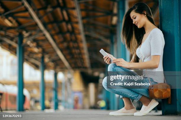 women waitintg on the train station in budapest - budapest train stock pictures, royalty-free photos & images