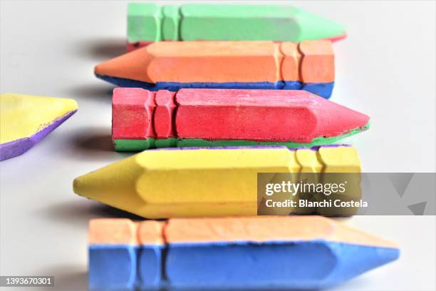 colored sidewalk chalk on white background - pastel crayon stock pictures, royalty-free photos & images