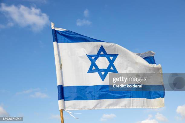 national flag of israel against blue sky . israeli independence day celebration - israeli flag 個照片及圖片檔