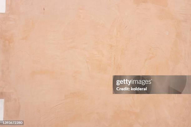 light orange colored plastered textured wall, full frame - beige stock pictures, royalty-free photos & images